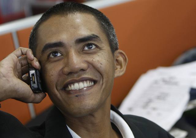 Mu, který vypadá jako Obama. Fotograf Ilham Anas ve své kancelái.